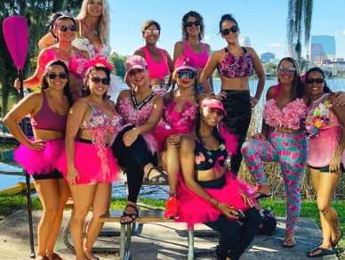 Women dressed in pink celebrating lakeside